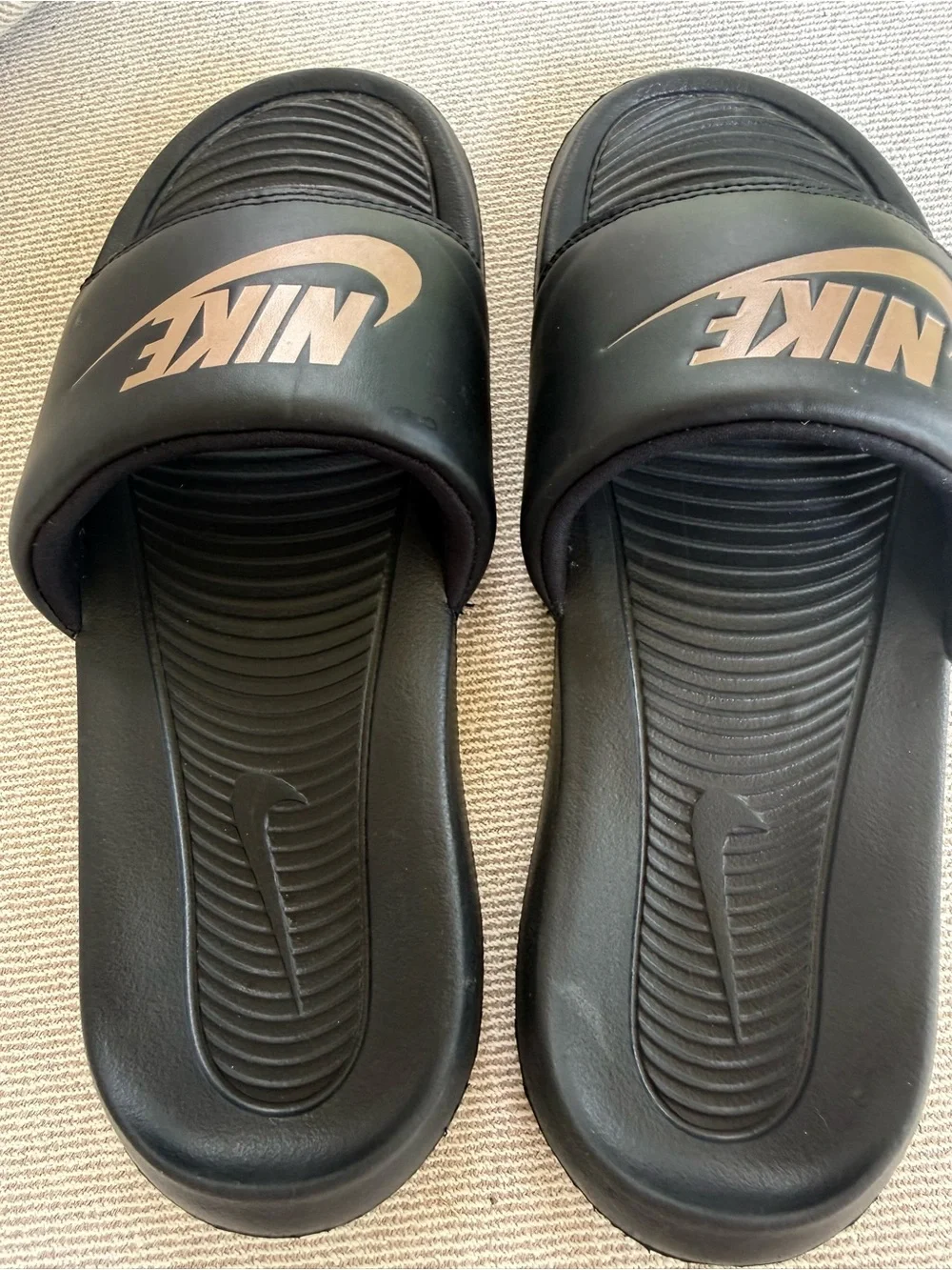 Nike Women’s  Black Slides with Metallic Gold Swoosh